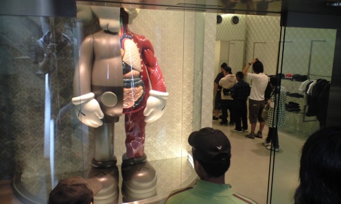 People buying their KAWS version stormtrooper at Original Fake shop in Tokyo.